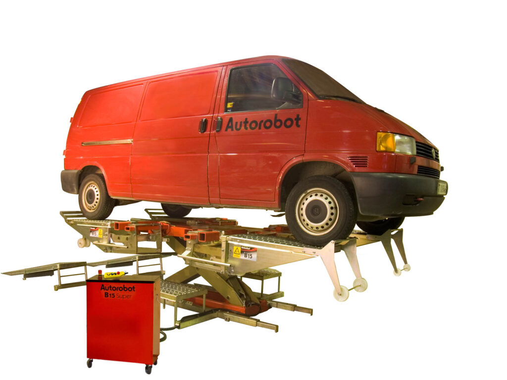 Frame machine with a red van on top of it